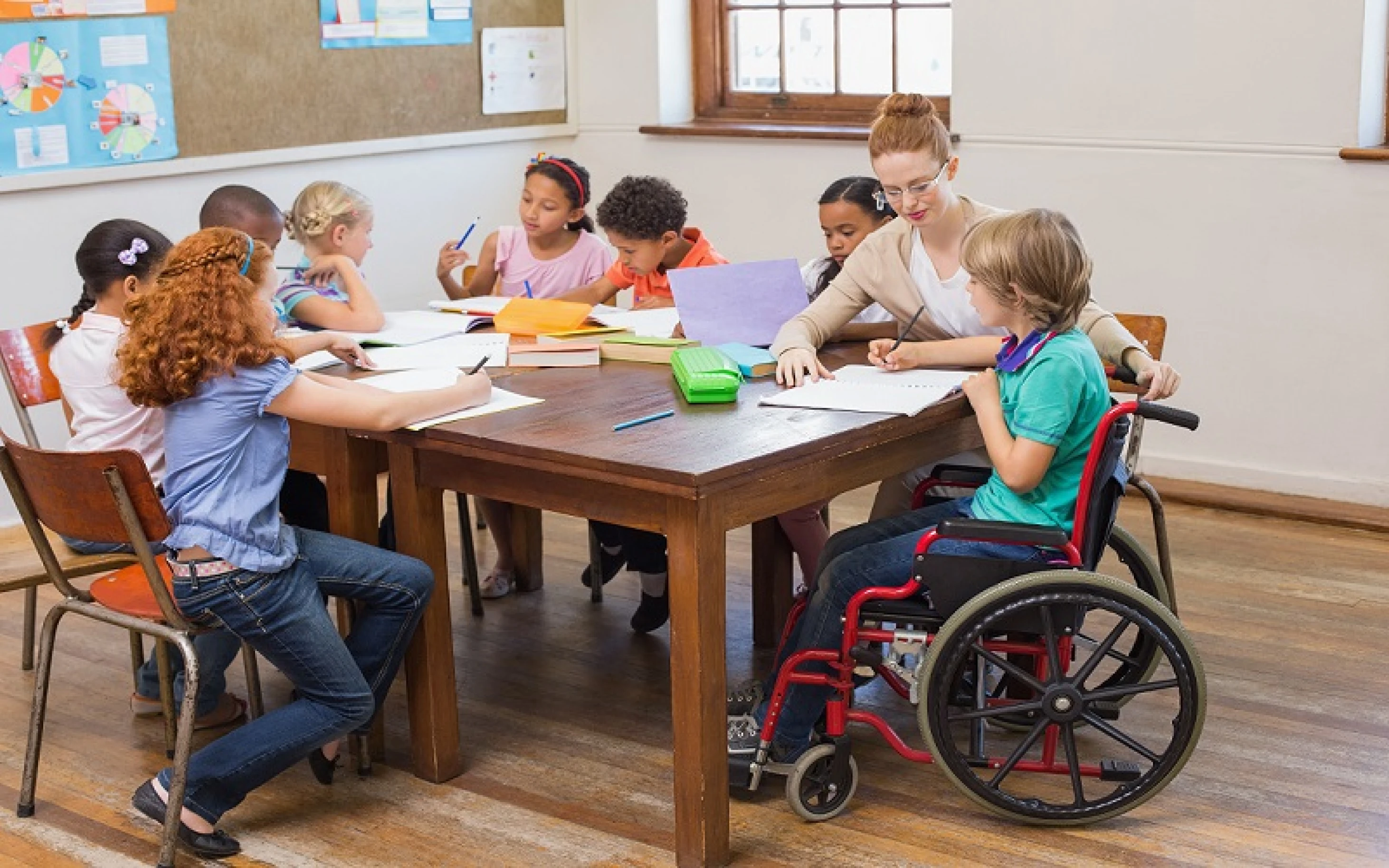 A teacher assisting a learner